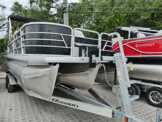 The Image of 2022 Godfrey Sweetwater Xperience 2286 FX pontoon boat on trailer. - 1