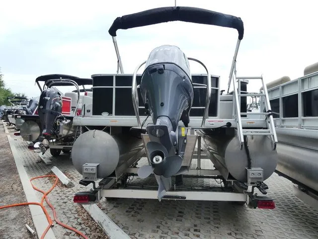 Slide: The Image of Rear view of a 2022 Godfrey Pontoons Sweetwater Xperience 2286 FX on a trailer. - 4
