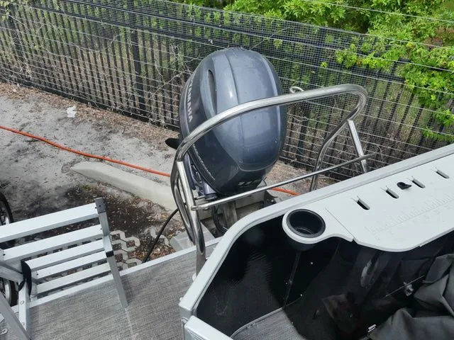 Slide: The Image of Rear view of 2022 Godfrey Pontoons Sweetwater Xperience 2286 FX with outboard motor. - 5