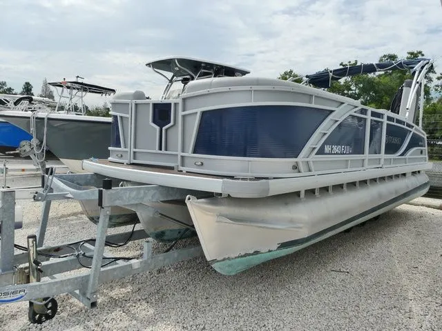 The Image of 2023 Godfrey Pontoons Monaco 235 C on trailer, side view. - 1