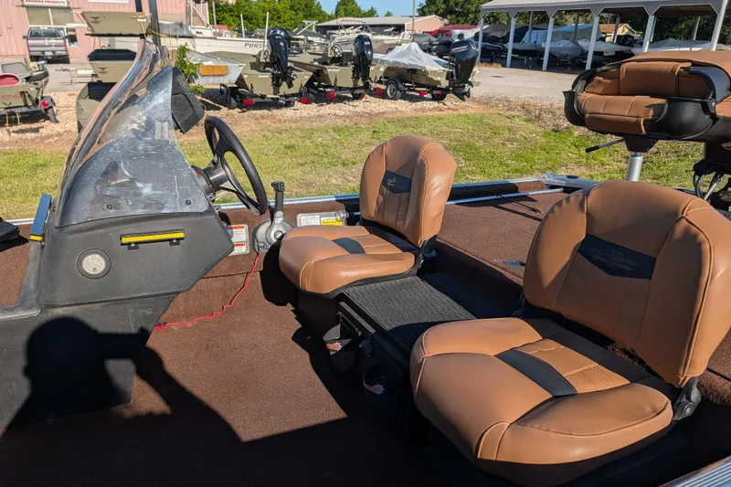 Slide: The Image of 2018 Tracker Bass Tracker 40th Anniversary Heritage Edition boat interior with brown seats. - 12