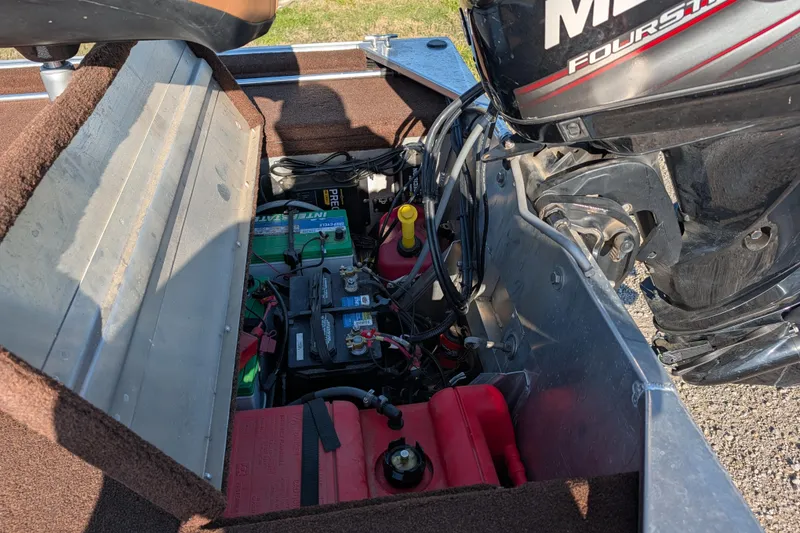Slide: The Image of 2018 Tracker Bass Tracker boat engine compartment with batteries and fuel tank. - 13