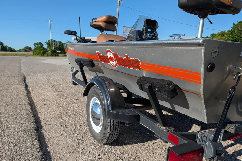 Slide: The Image of 2018 Tracker Bass Tracker 40th Anniversary Heritage Edition boat on trailer, parked on gravel road. - 4