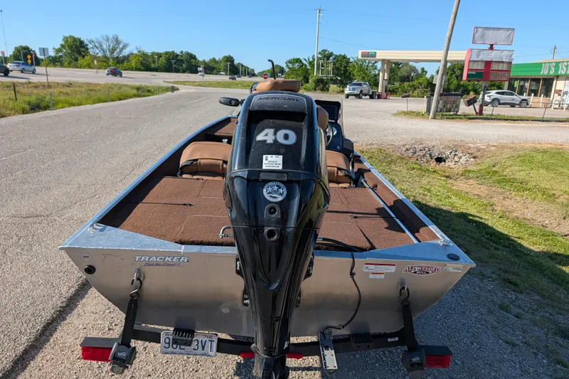 Slide: The Image of 2018 Tracker Bass Tracker 40th Anniversary Heritage Edition boat with Mercury engine on a roadside. - 5