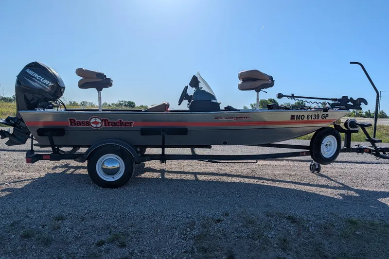 Slide: The Image of 2018 Tracker Bass Tracker 40th Anniversary Heritage Edition boat on trailer, sunny day. - 8