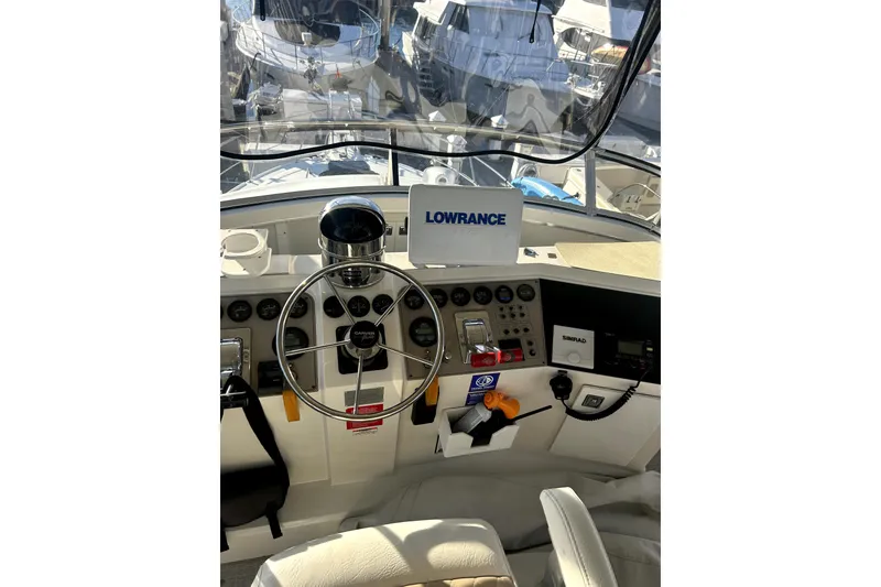 Slide: The Image of Cockpit view of 1997 Carver 430 Cockpit Motor Yacht with navigation equipment. - 11