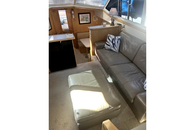 Slide: The Image of Interior of 1997 Carver 430 Cockpit Motor Yacht with seating and modern decor. - 14