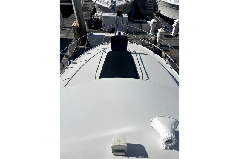 Slide: The Image of 1997 Carver 430 Cockpit Motor Yacht deck view at marina. - 24