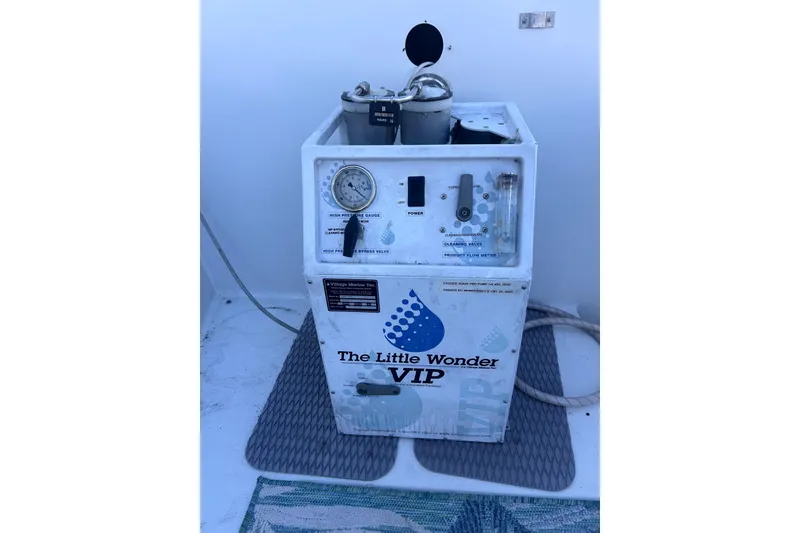 Slide: The Image of The Little Wonder VIP watermaker on 1997 Carver 430 Cockpit Motor Yacht deck. - 26