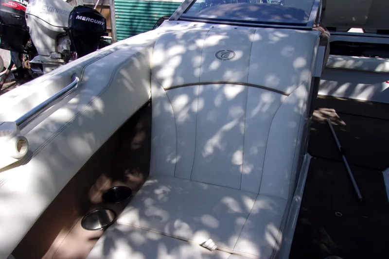 Slide: The Image of Interior of a 2007 Cobalt 222 boat with white seating and cup holders. - 14