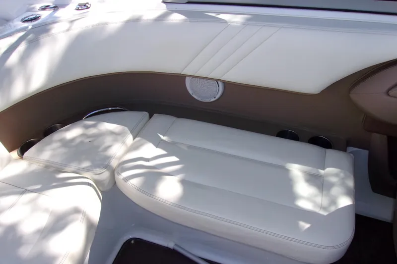 Slide: The Image of Luxurious white seating in a 2007 Cobalt 222 boat interior. - 16