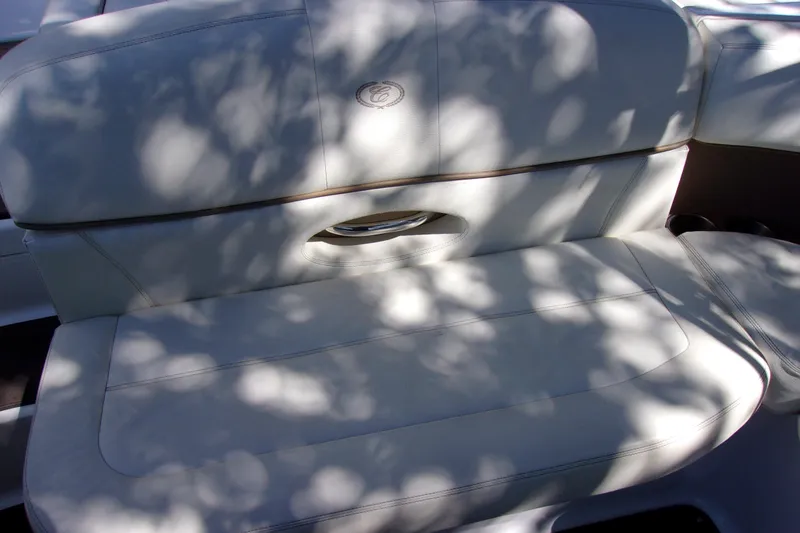 Slide: The Image of White leather seating in a 2007 Cobalt 222 boat, dappled sunlight effect. - 17