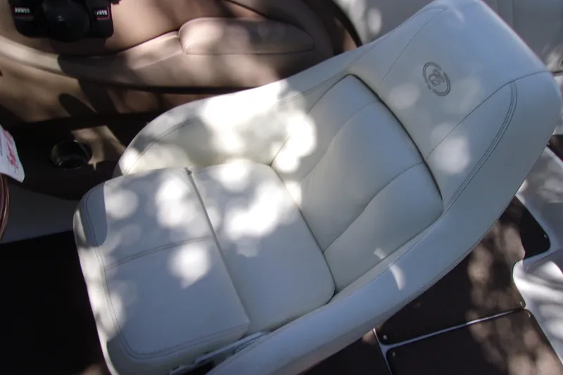 Slide: The Image of Luxurious white leather seat in a 2007 Cobalt 222 boat interior. - 8