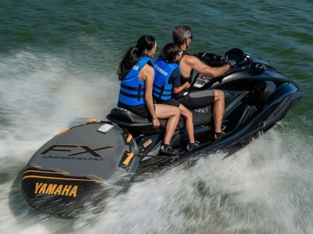 Slide: The Image of 2026 Yamaha WaveRunner FX Limited SVHO on water with three riders. - 3