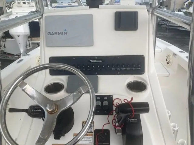 Slide: The Image of Control console of a 2020 Pathfinder 2500 Hybrid boat. - 4