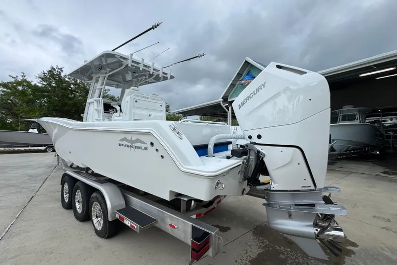 Slide: The Image of 2026 Invincible 33 Open Fisherman boat with Mercury engine on a trailer. - 15