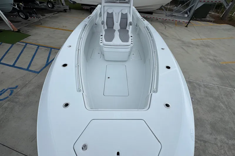 Slide: The Image of 2026 Invincible 33 Open Fisherman boat, spacious deck view, sleek design, and modern seating. - 20