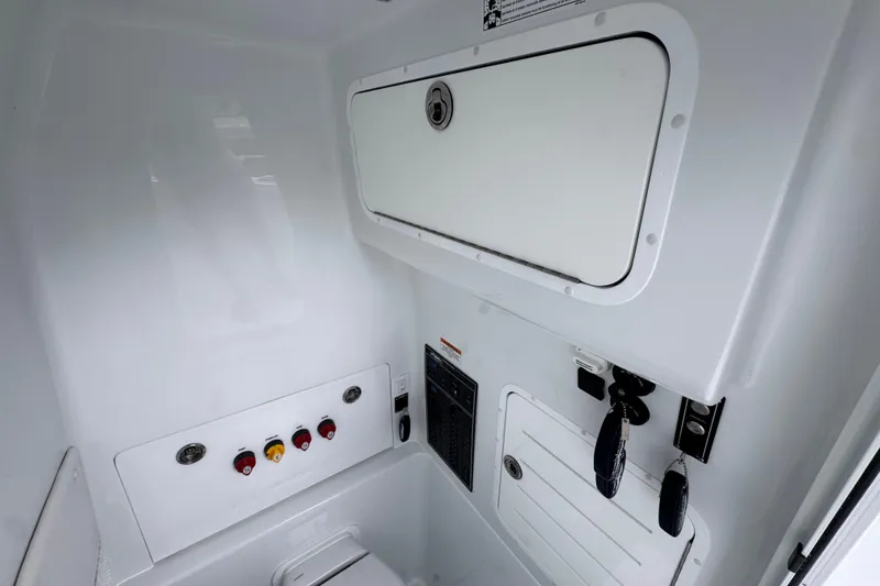 Slide: The Image of Interior view of 2026 Invincible 33 Open Fisherman boat's control panel and storage compartments. - 27