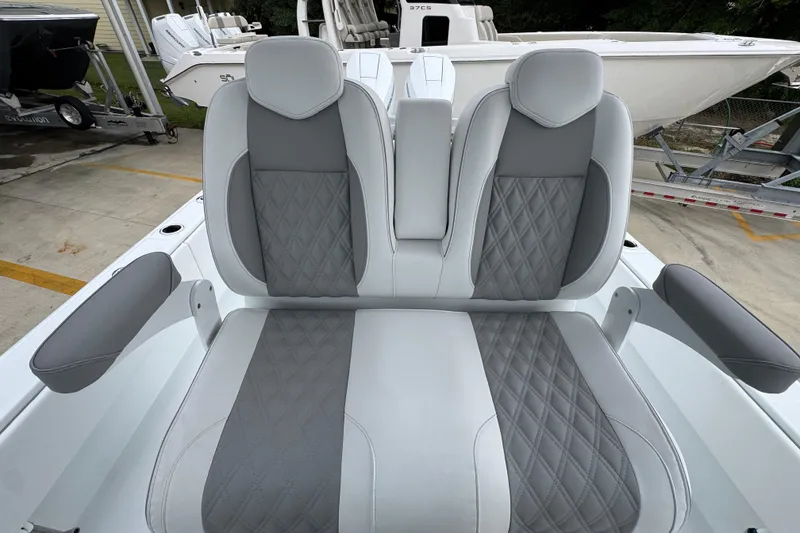 Slide: The Image of Luxury seating on 2026 Invincible 33 Open Fisherman boat, featuring gray and white upholstery. - 29