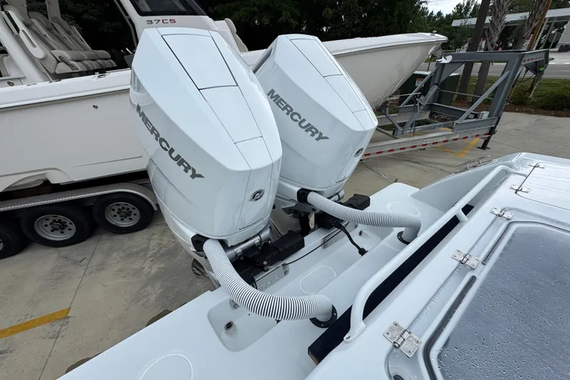 Slide: The Image of 2026 Invincible 33 Open Fisherman with dual Mercury outboard engines. - 41