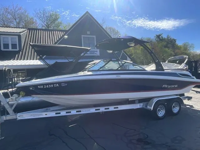 The Image of 2013 Bryant Boats 233X on trailer in front of building. - 1