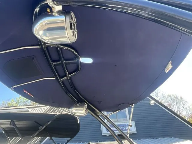 Slide: The Image of Bimini top of a 2013 Bryant Boats 233X with speakers. - 10