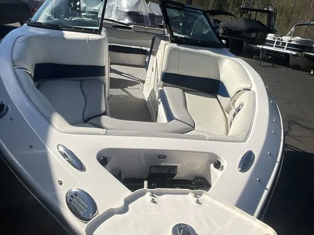 Slide: The Image of 2013 Bryant Boats 233X interior with white upholstery. - 11