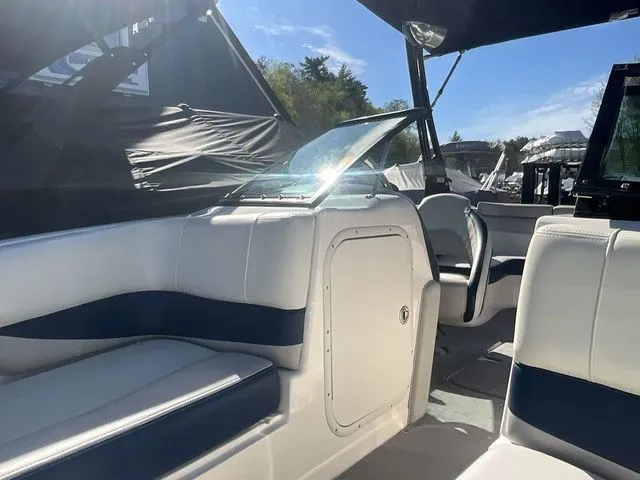Slide: The Image of Interior of a 2013 Bryant Boats 233X with white seating. - 15