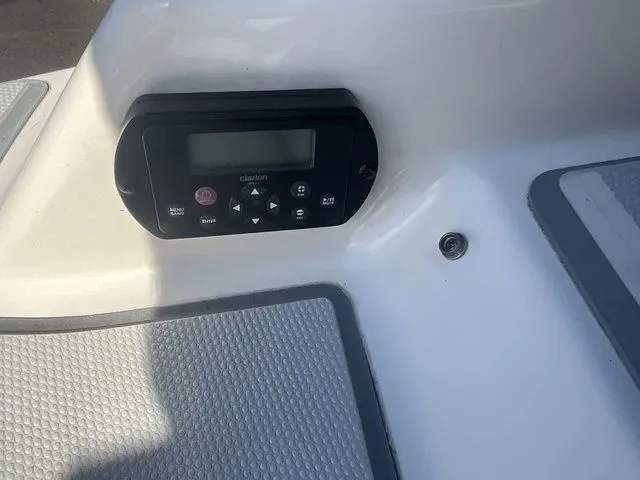 Slide: The Image of Control panel of a 2013 Bryant Boats 233X with controls. - 16