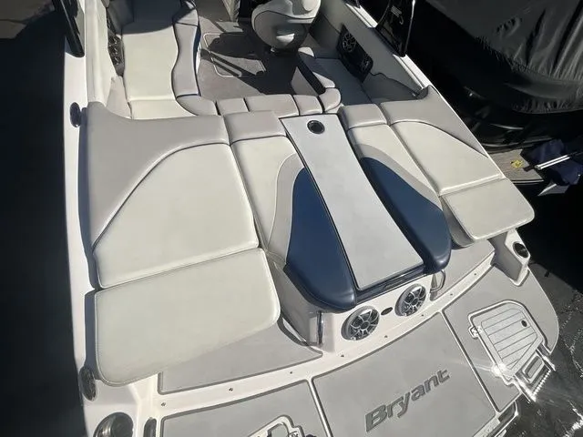 Slide: The Image of 2013 Bryant Boats 233X interior with gray and blue upholstery. - 19