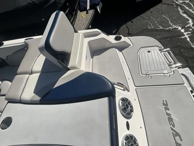 Slide: The Image of Interior of a 2013 Bryant Boats 233X with seating area and speakers. - 20