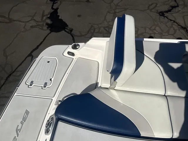 Slide: The Image of Interior of a 2013 Bryant Boats 233X with blue and white seating. - 21