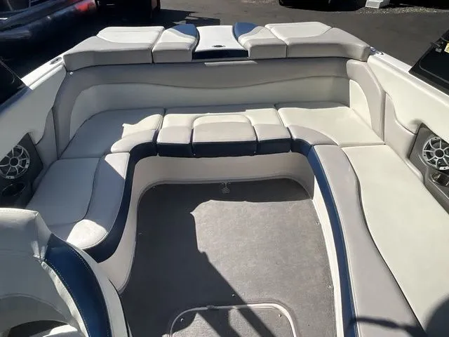 Slide: The Image of Interior of 2013 Bryant Boats 233X with gray and blue upholstery. - 25