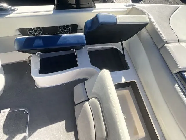 Slide: The Image of Interior of a 2013 Bryant Boats 233X with seating and storage. - 28