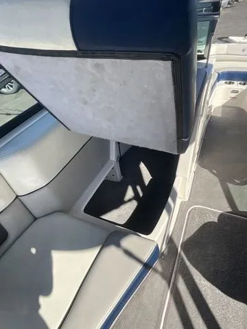 Slide: The Image of Interior of a 2013 Bryant Boats 233X with white seating. - 30