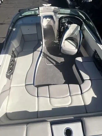 Slide: The Image of Interior of a 2013 Bryant Boats 233X with white upholstery. - 31