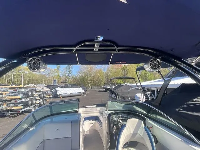 Slide: The Image of Interior view of 2013 Bryant Boats 233X with speakers and helm console. - 32