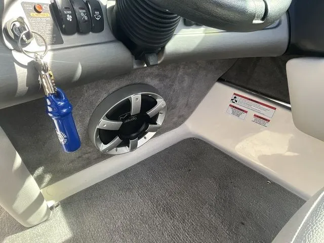 Slide: The Image of Interior of 2013 Bryant Boats 233X with speaker and keys. - 34