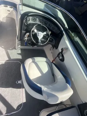 Slide: The Image of Interior of a 2013 Bryant Boats 233X with steering console. - 35