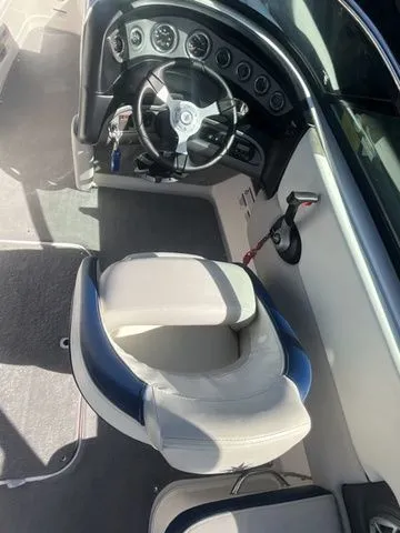 Slide: The Image of Interior of a 2013 Bryant Boats 233X with steering console. - 36