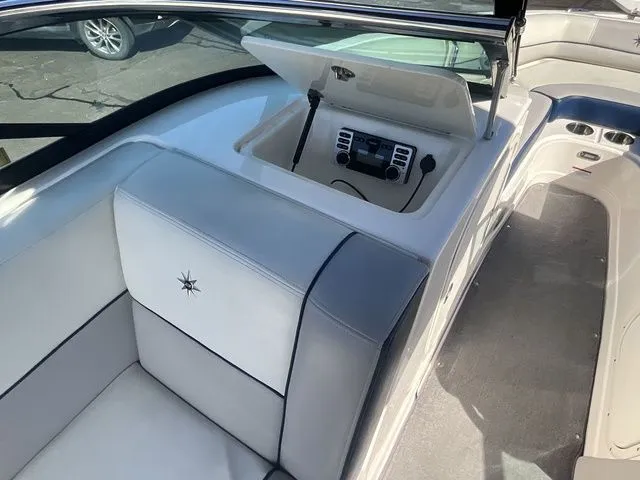 Slide: The Image of Interior of 2013 Bryant Boats 233X with seating area and control console. - 41