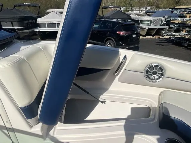 Slide: The Image of Interior of a 2013 Bryant Boats 233X with blue and white seating. - 47