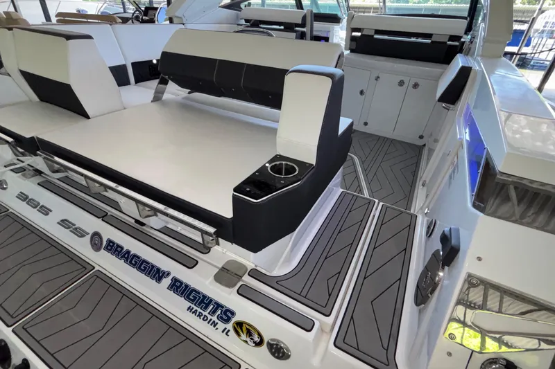 Slide: The Image of 2023 Monterey 385SS Super Sport boat interior with sleek seating and modern design. - 11