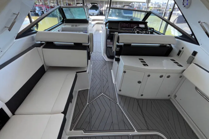 Slide: The Image of 2023 Monterey 385SS Super Sport boat interior with sleek seating and modern dashboard design. - 15