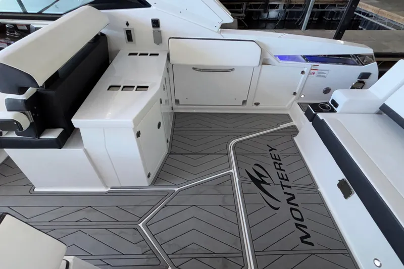 Slide: The Image of 2023 Monterey 385SS Super Sport boat interior with sleek seating and modern design. - 16