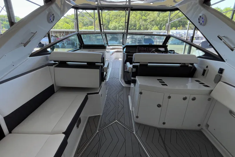 Slide: The Image of 2023 Monterey 385SS Super Sport boat interior with sleek seating and modern design. - 17