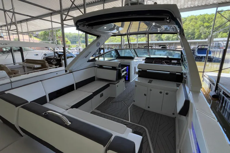 Slide: The Image of 2023 Monterey 385SS Super Sport boat interior with sleek seating and modern design. - 19