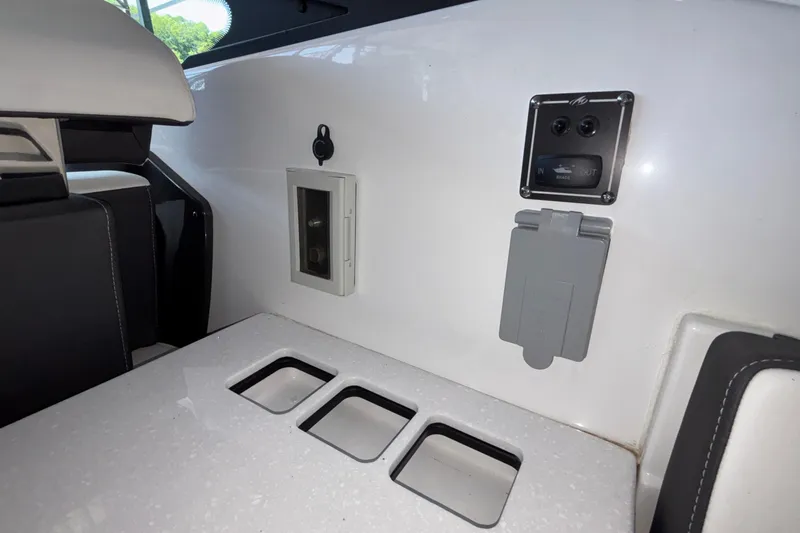Slide: The Image of Interior view of 2023 Monterey 385SS Super Sport boat, featuring control panel and seating area. - 24