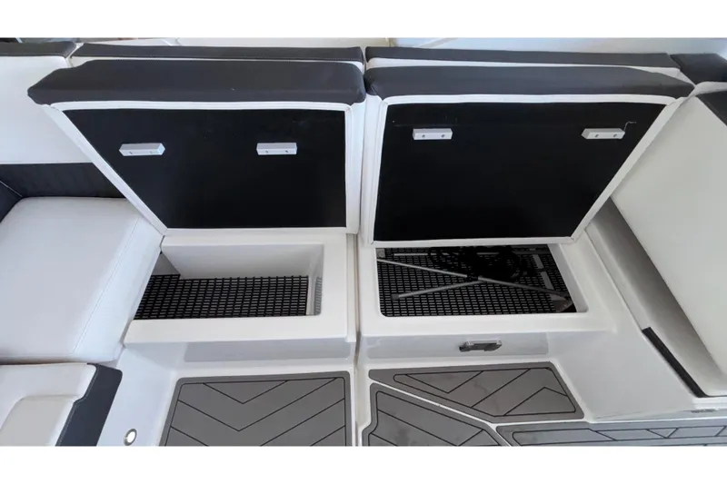 Slide: The Image of 2023 Monterey 385SS Super Sport boat interior storage compartments open. - 30