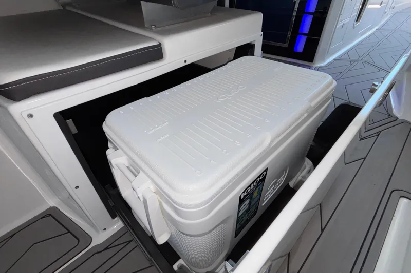 Slide: The Image of 2023 Monterey 385SS Super Sport boat interior with built-in cooler storage. - 33